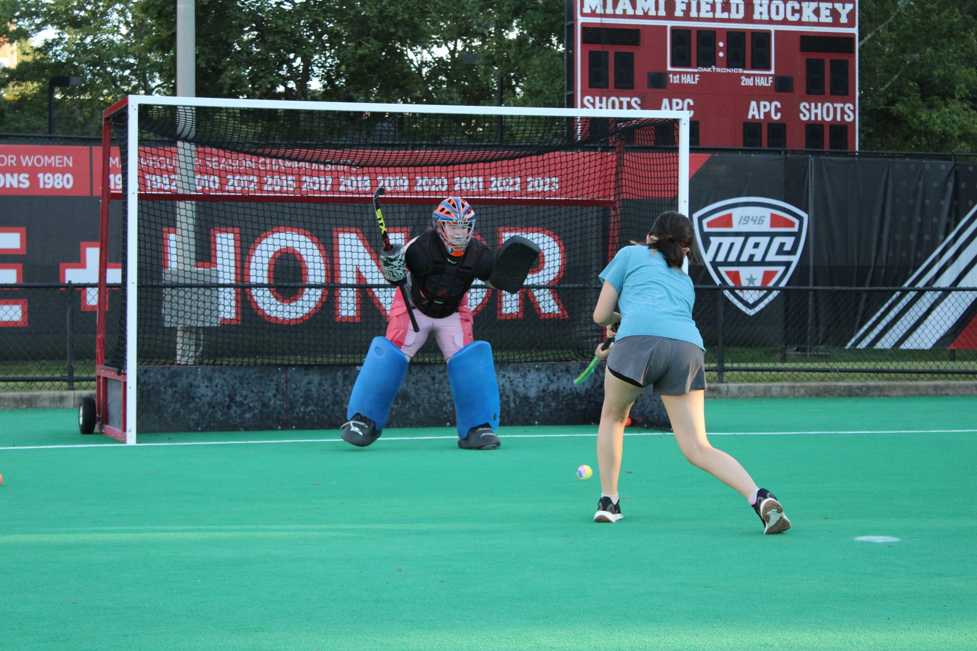 A player shoots the ball toward the goalie