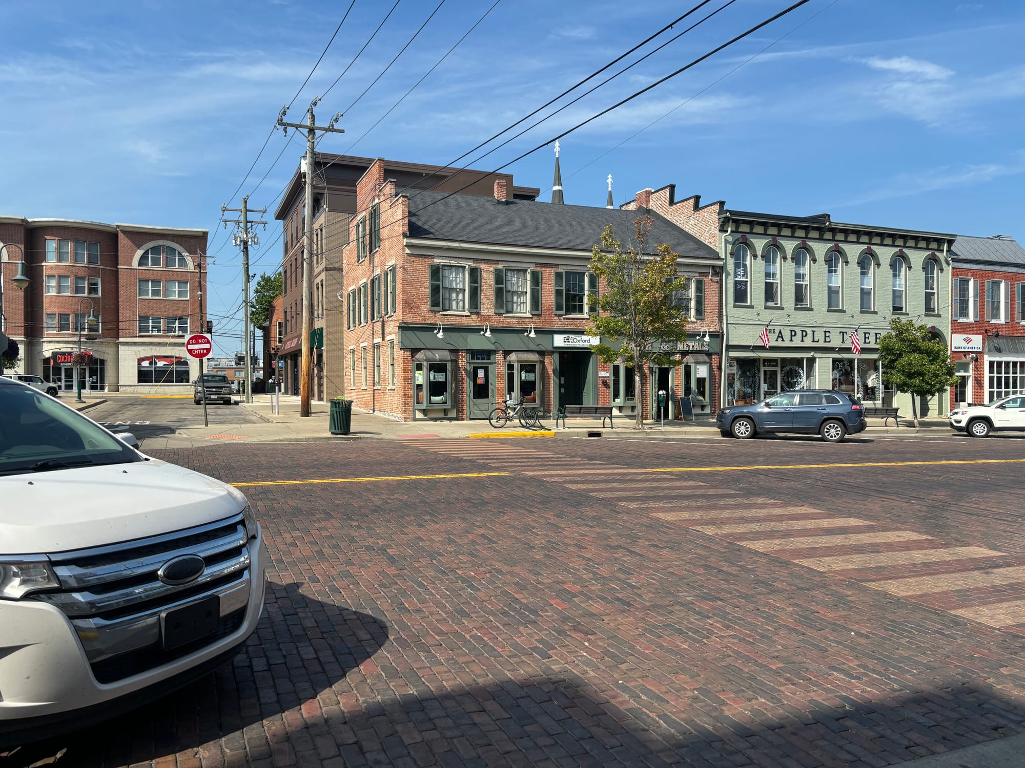 Uptown Blends, a brick building, as seen from across the street