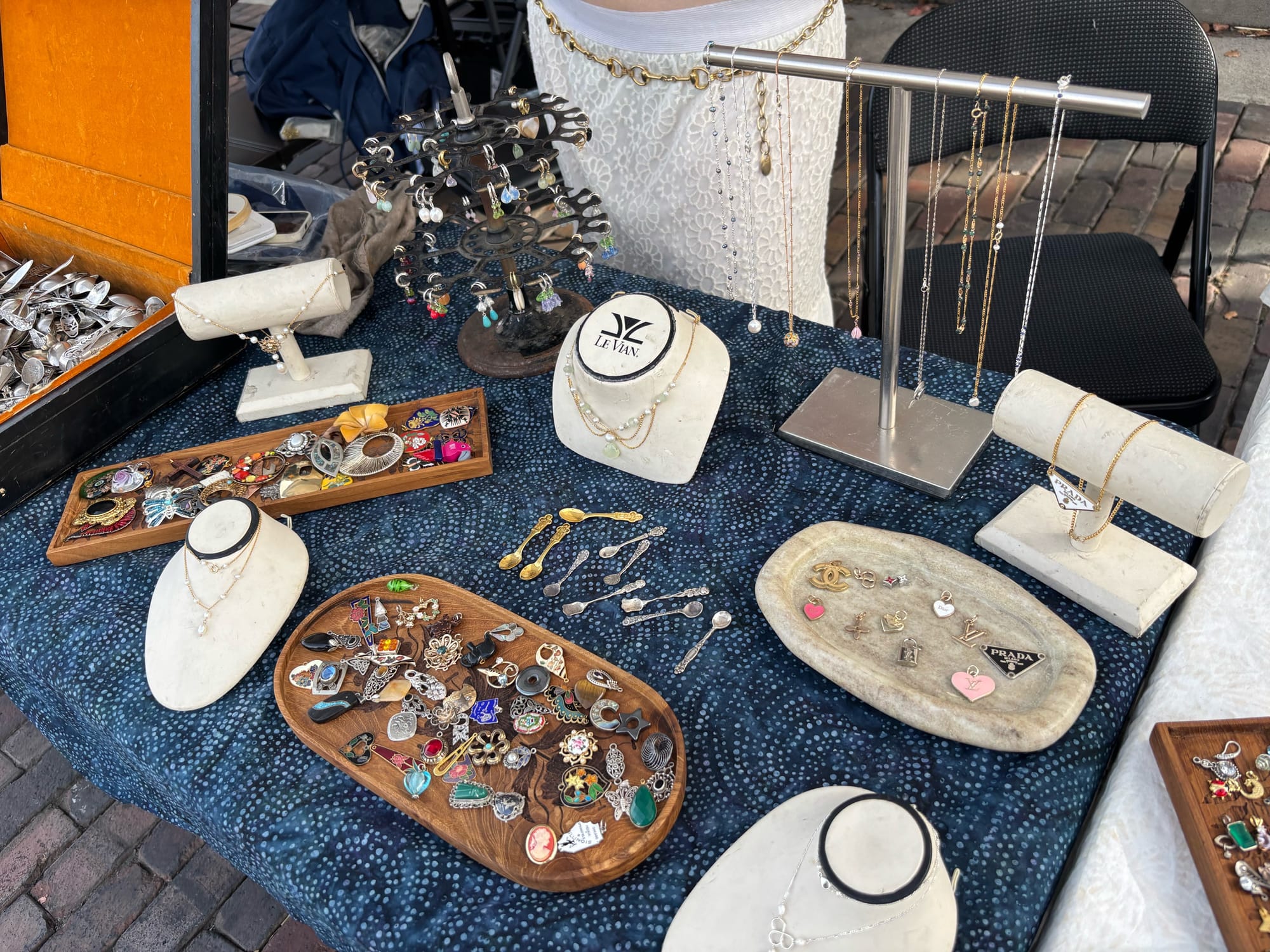 A table filled with different vintage jewelry items by JG Jewelry