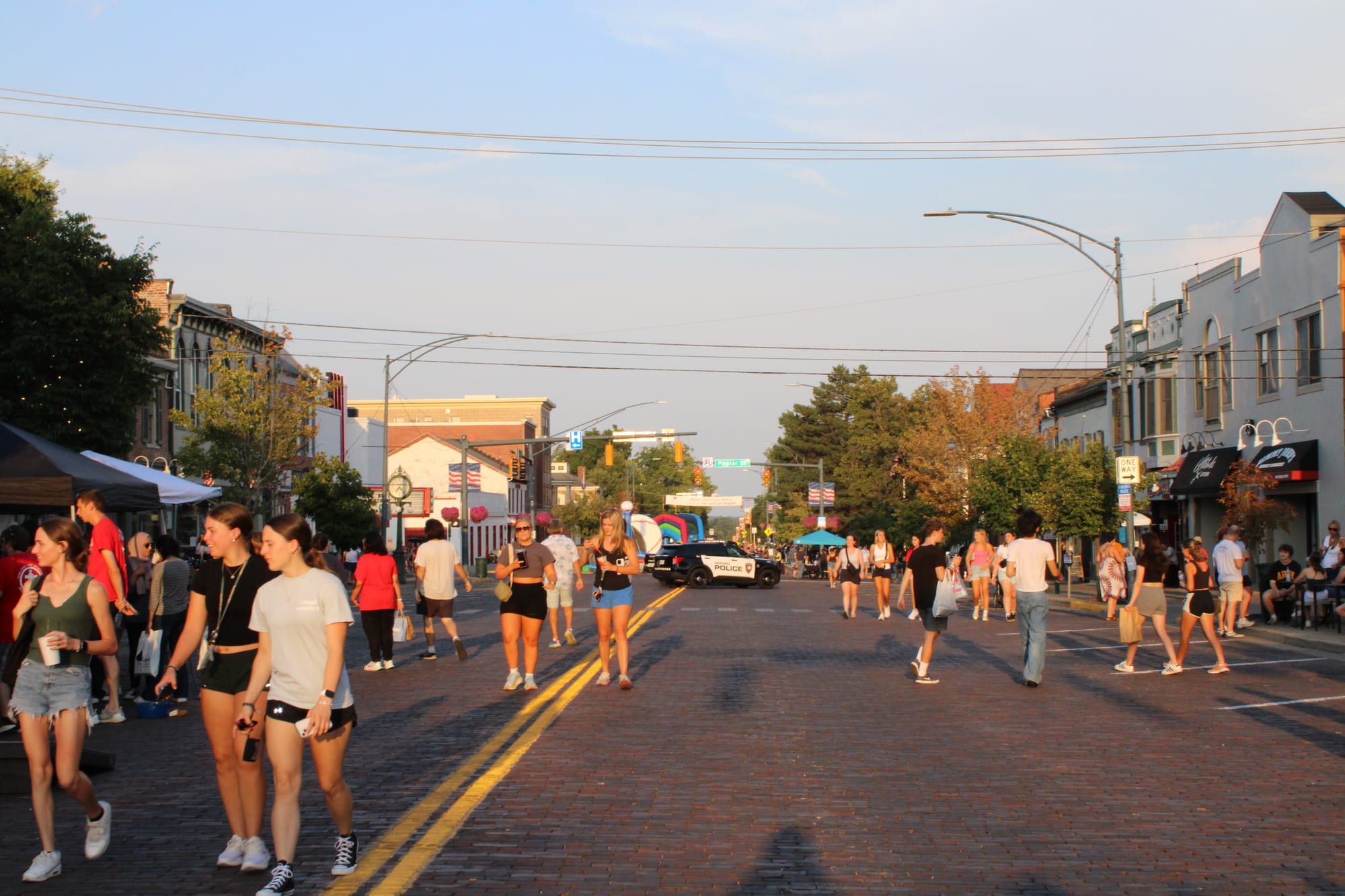 People walking on the brick streets of Uptown