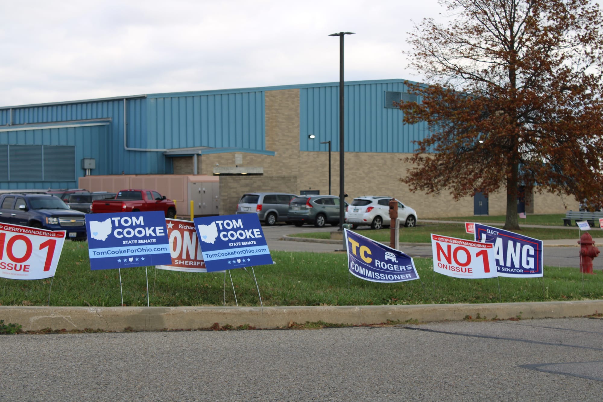 Political yard signs for "No on Issue 1," Tom Cooke, and George Lang outside Talawanda Middle School