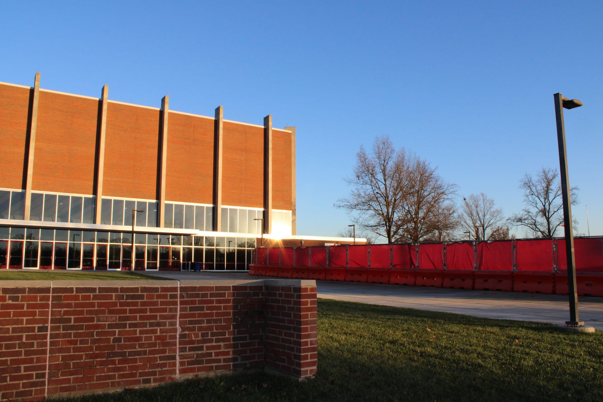 Millett Hall from the west with a red fence in front of it