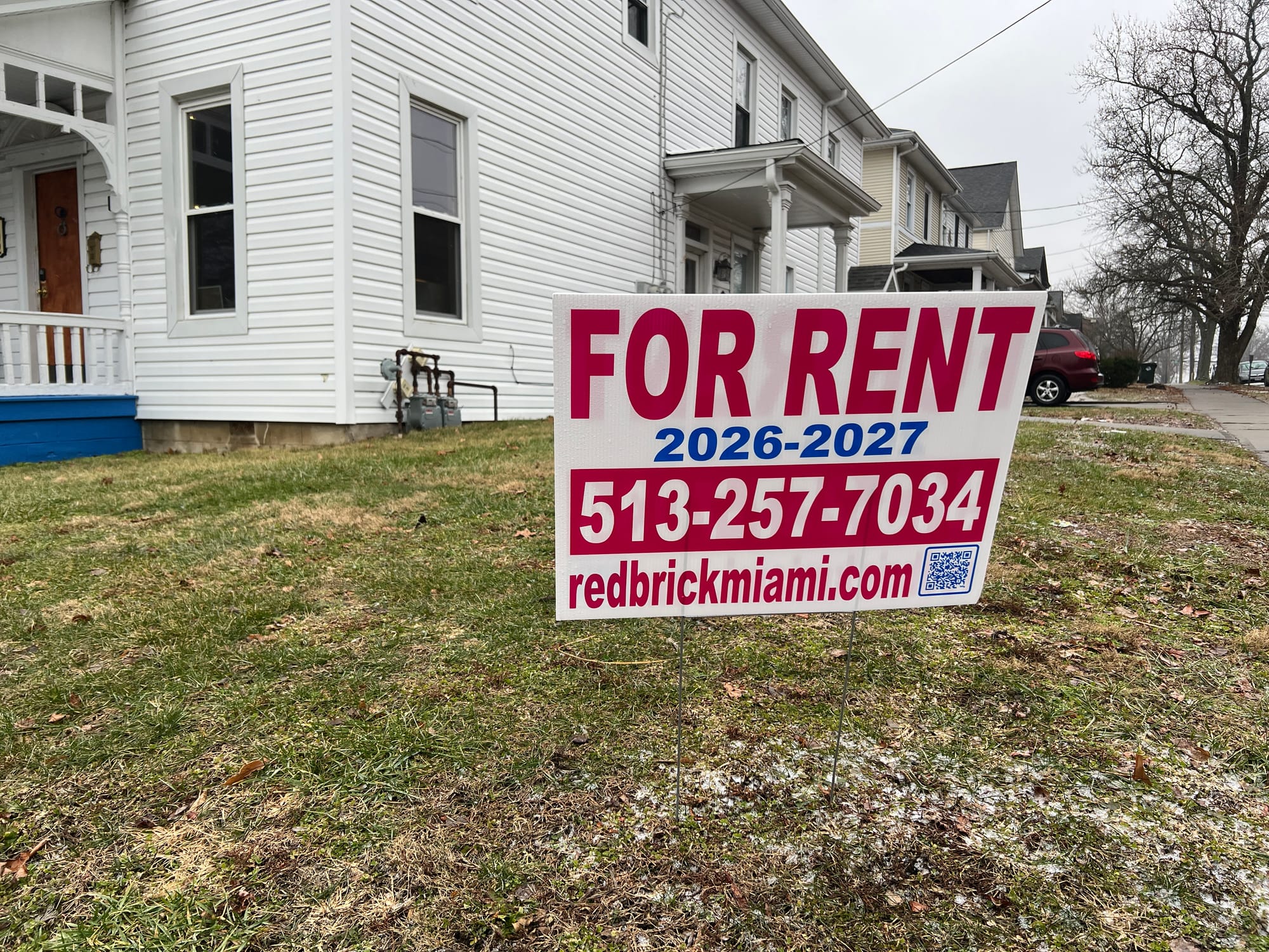 A sign in front of a house reads "For rent 2026-2027"