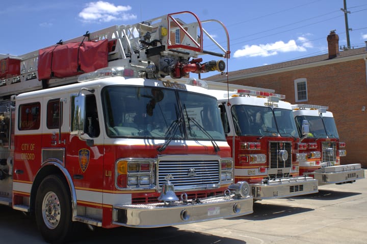 Three fire enignes lined up outside the Oxford Fire Department