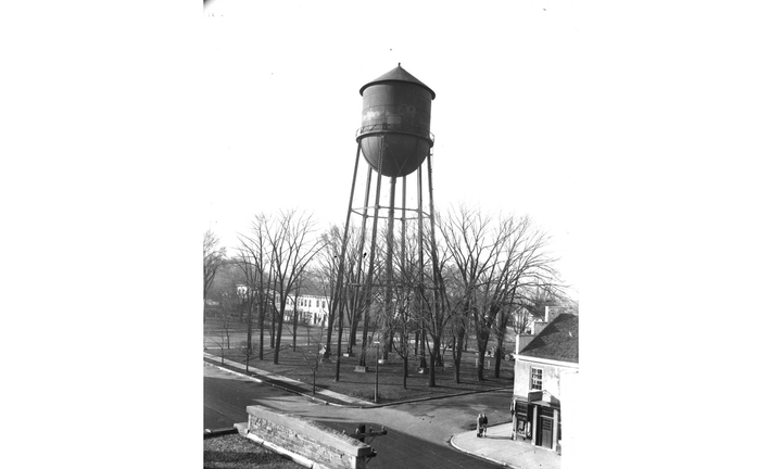 Black and white photo of tall water tower in Uptown Oxford