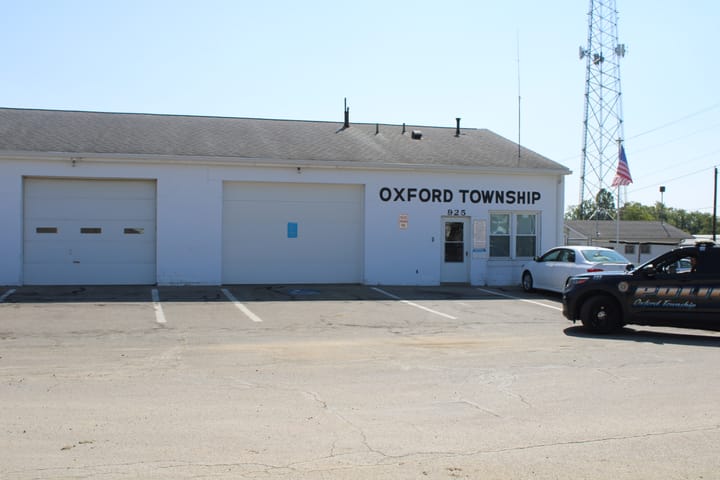 An Oxford Township police cruiser pulls out of the Oxford Township building parking lot