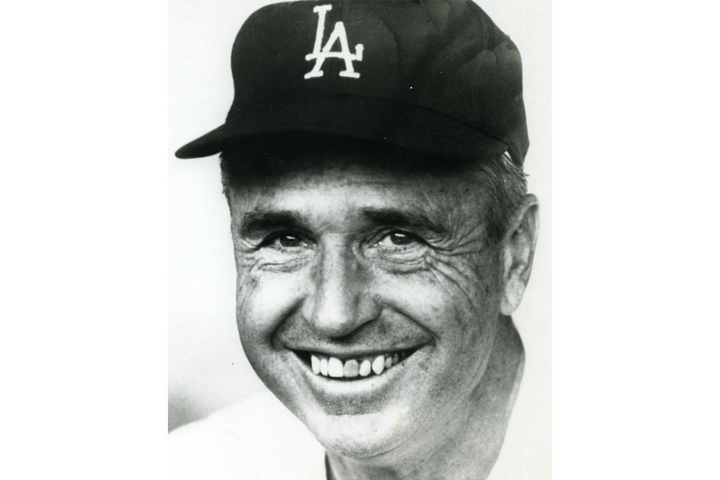 Black and white portait of Walter “Smokey” Alston in a baseball cap