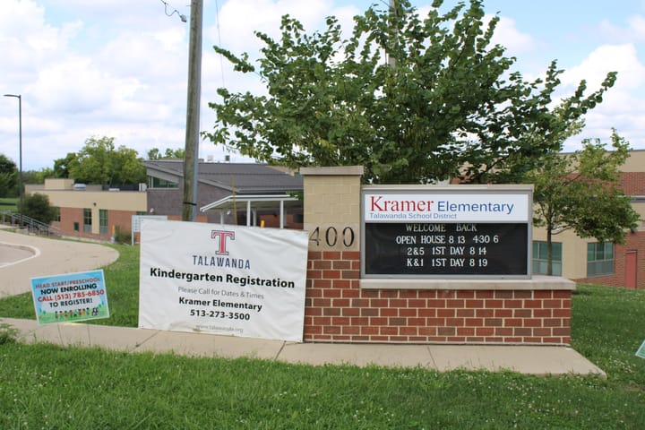 A sign for Kramer Elementary in front of the school