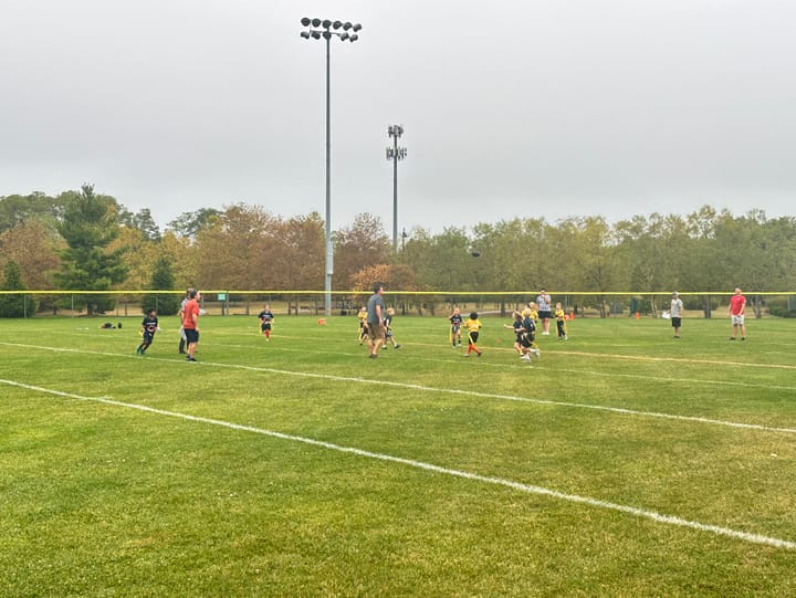 Parents endured rainy conditions to watch the Vikings vs. Cubs game on Sept. 23. .Photo by Austin Smith