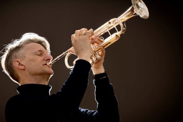 Jimmy Leach seen playing his trumpet