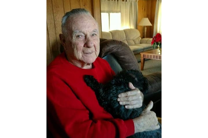 John Bailey Jr. holding a dog