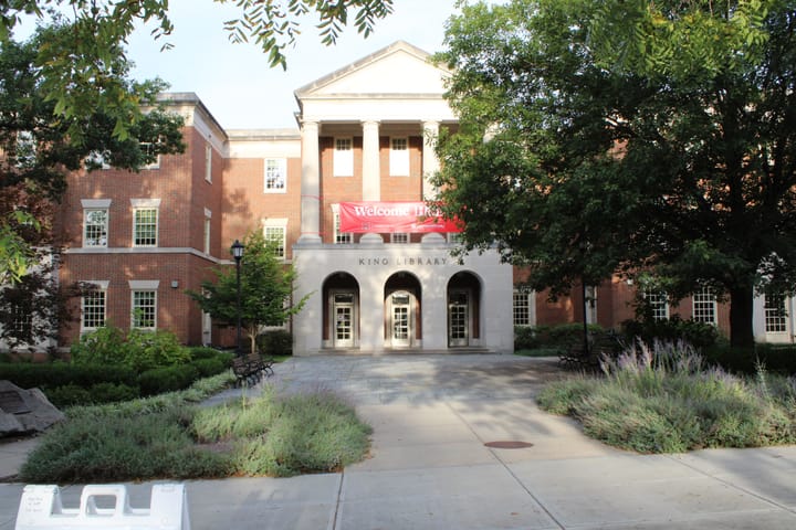 King Library with a "Welcome Home" banner strung above the front entrance