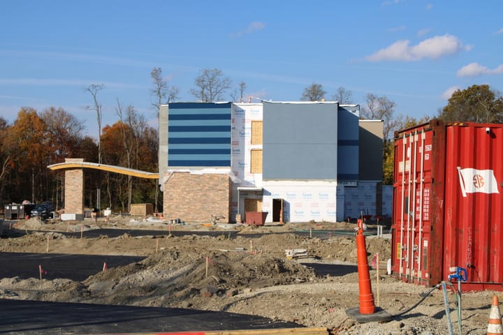 A construction site with a mostly complete hotel