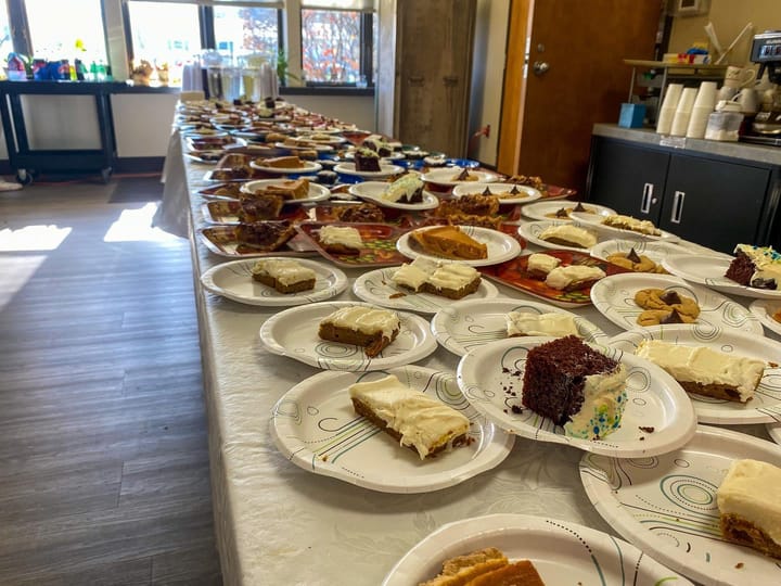 Hundreds of dessert plates on a table in the Oxford Seniors building