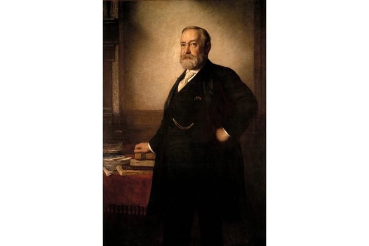 Portrait of Benjamin Harrison standing in front of a desk