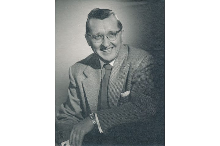 Black and white photo of Kep Small in a suit