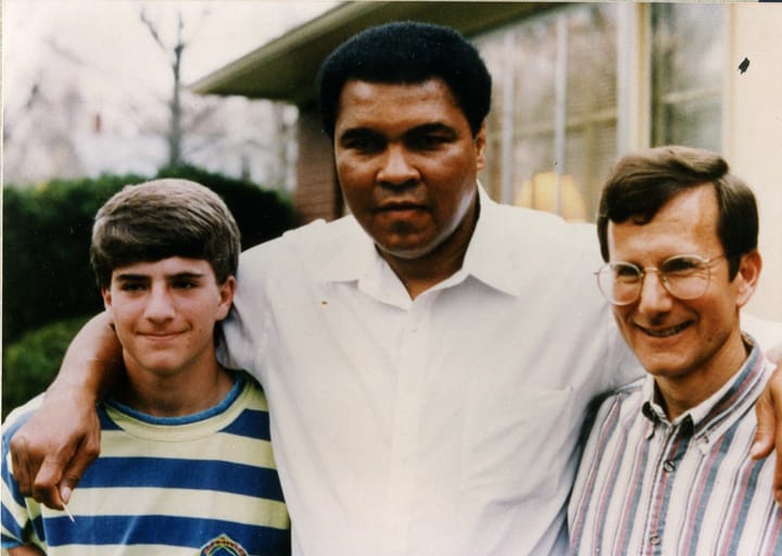 Muhammad Ali stands between David and Allan Winkler