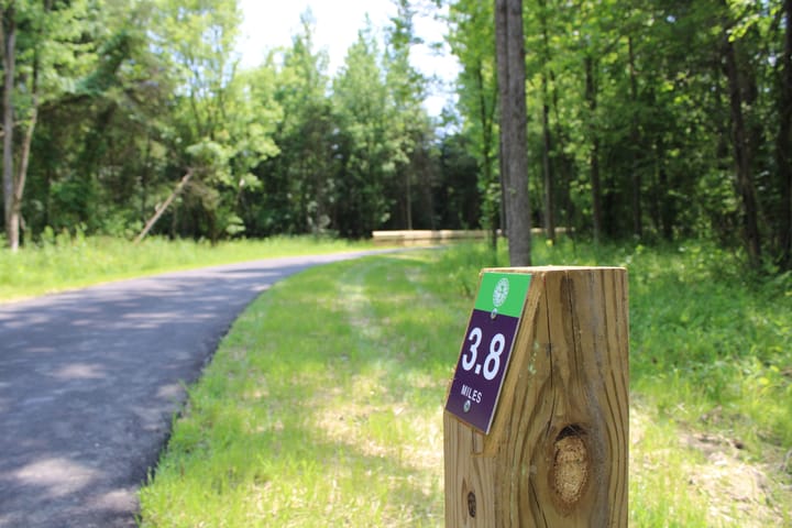 A 3.8 mile marker in front of the Oxford Area Trail System