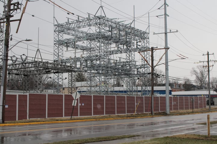 Locust Street Substation with brick wall in front of it