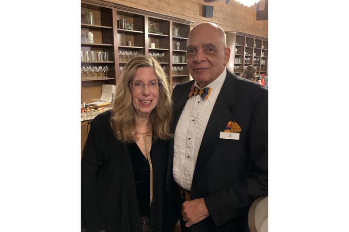 Sybil and Bill Miller stand next to each other in formal attire